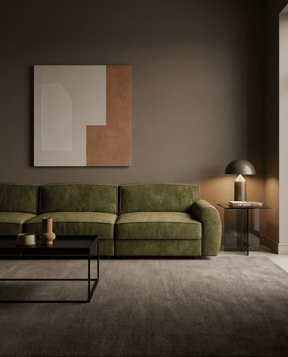 Modern living room with a green sofa, abstract painting, and side table.
